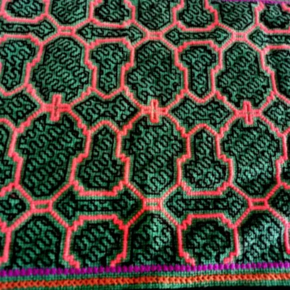Hand embroidered shipibo altar design multicolored patterns Amazon jungle